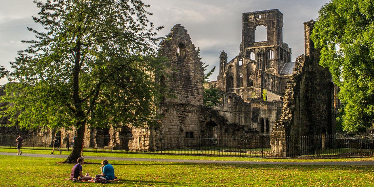 The remains of Kirkstall Abbey on a summer's day.
