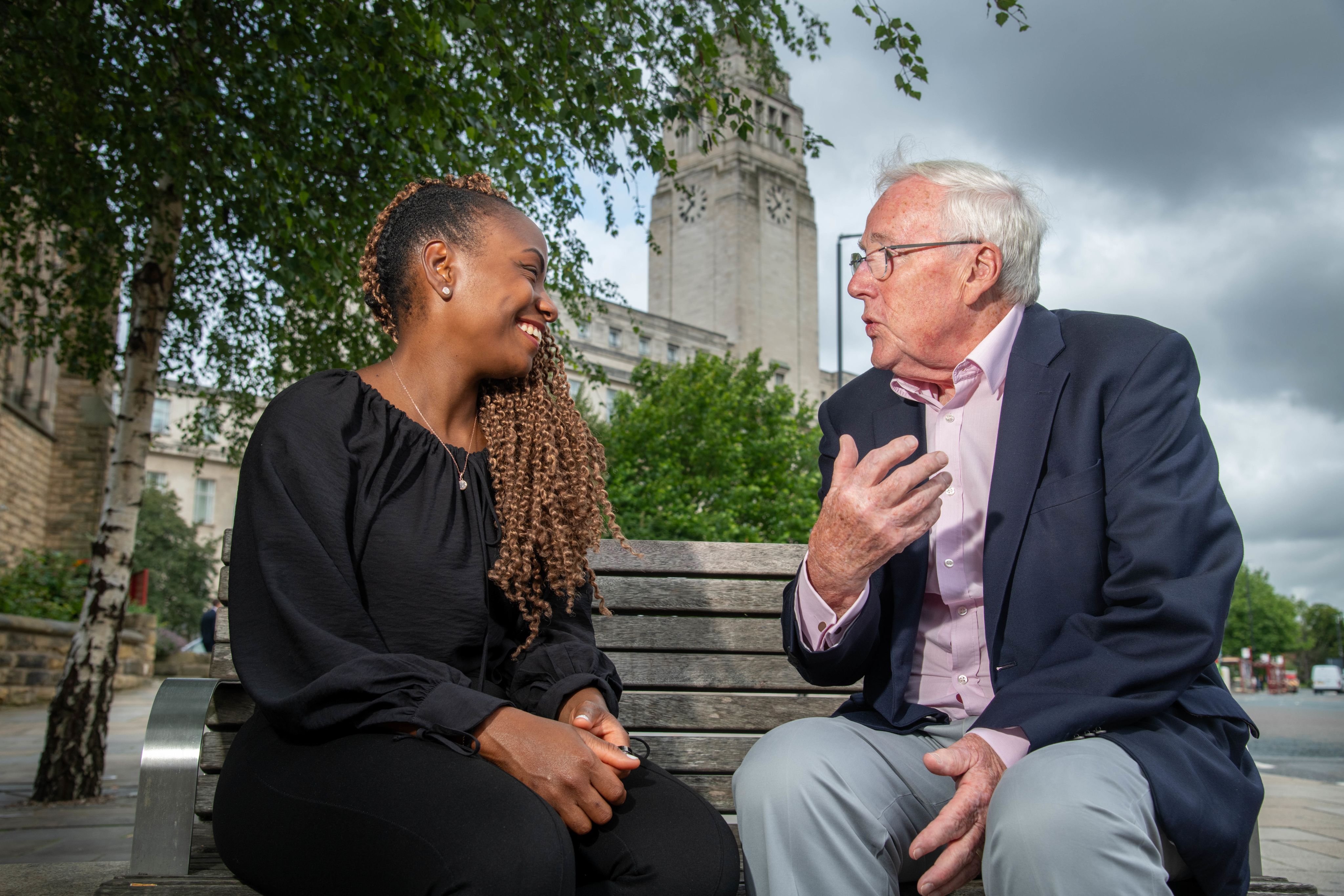 Emillie in front of the Great Hall with Parkinson Tower visible in the background