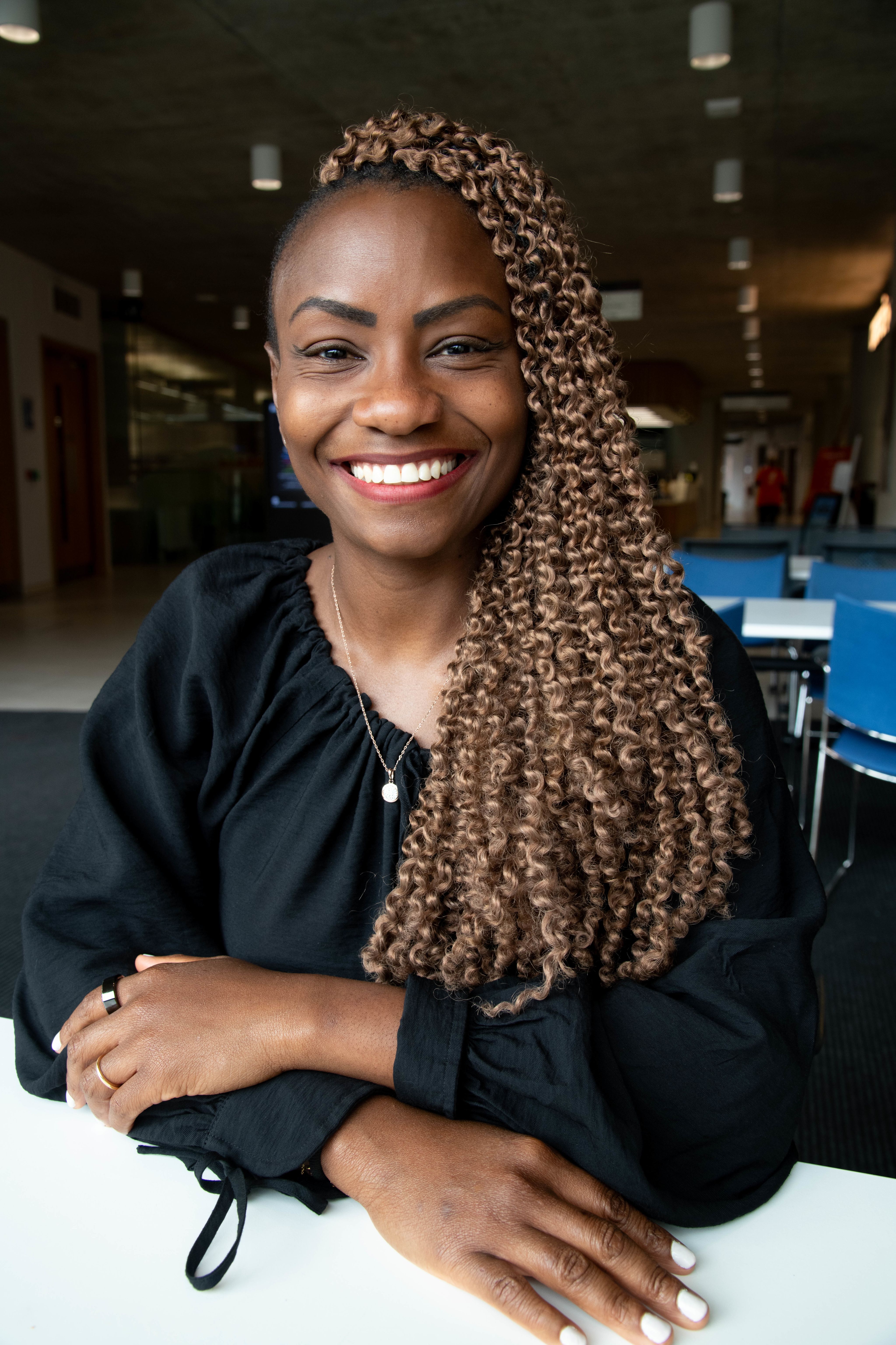 Emillie with son walking down toward Campus from town.
