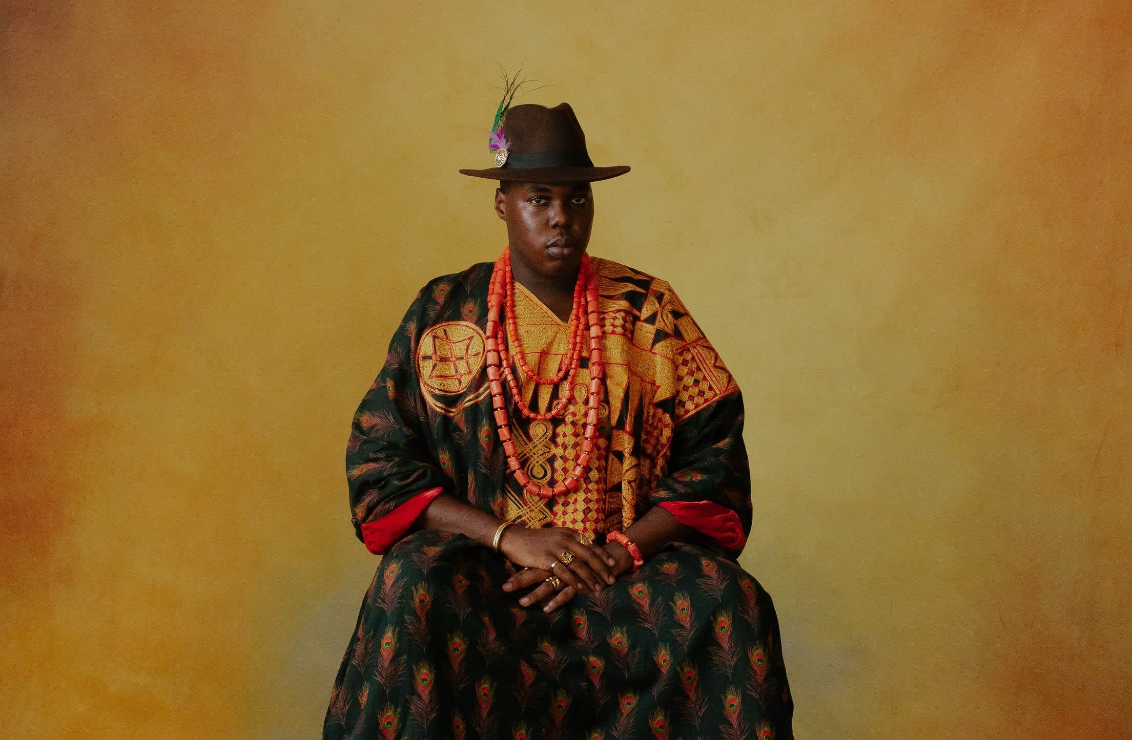 A man wearing colourful patterned clothing