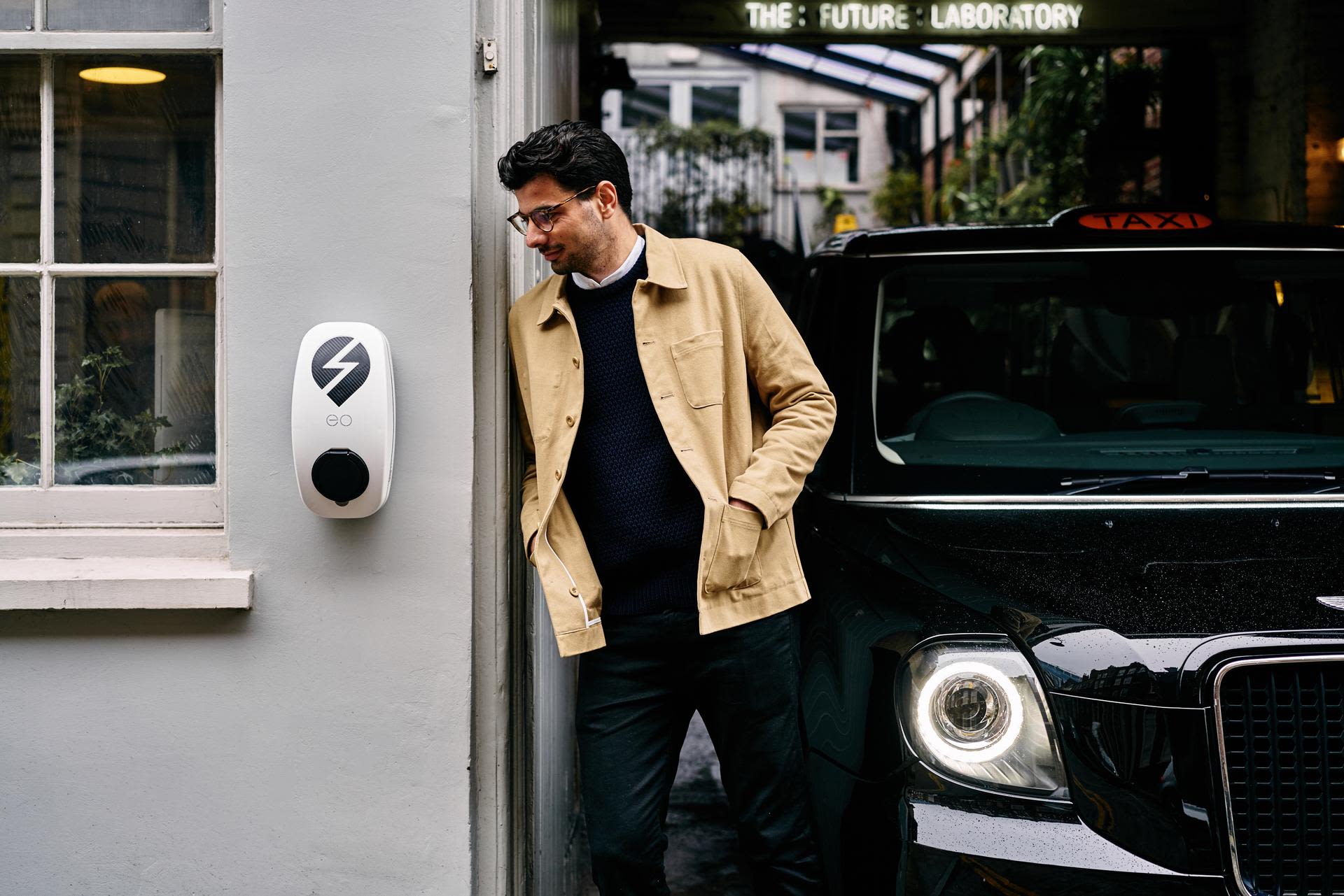 Charlie Jardine beside a charging point