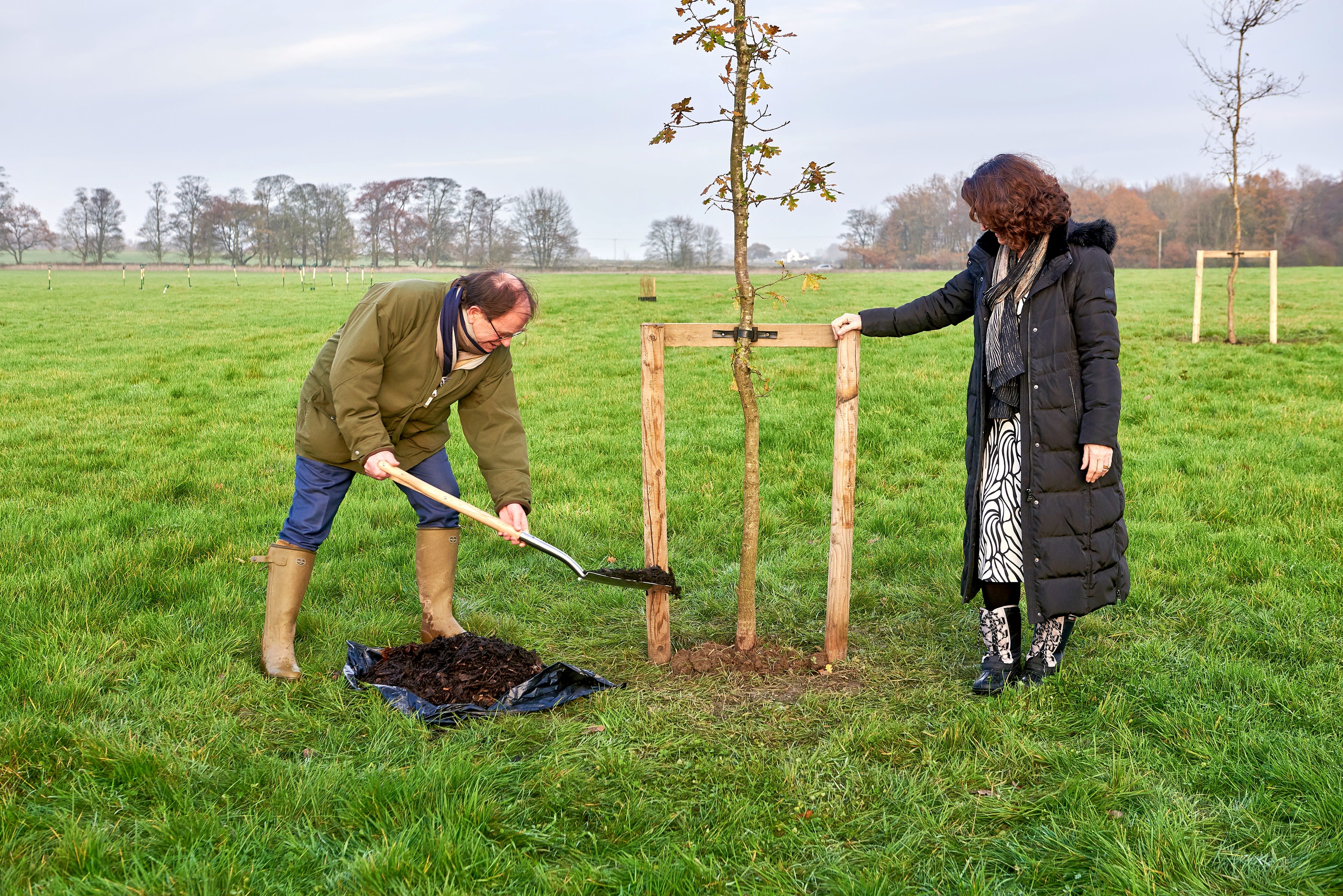 Roger Gair and University of Leeds' Vice Chancellor Simone Buitendijk planting the first tree at Gair Wood.