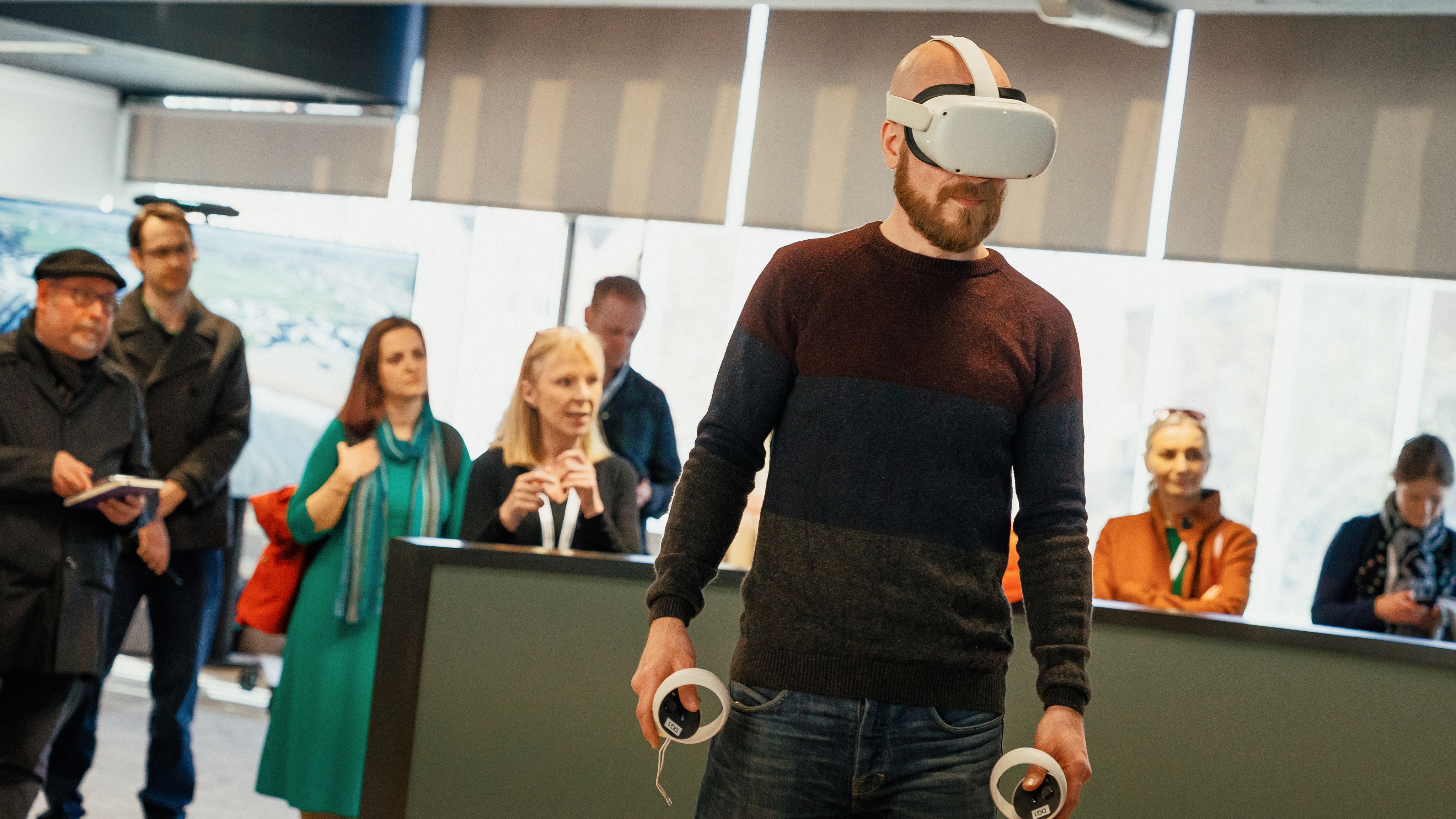 Man stands wearing a VR headset