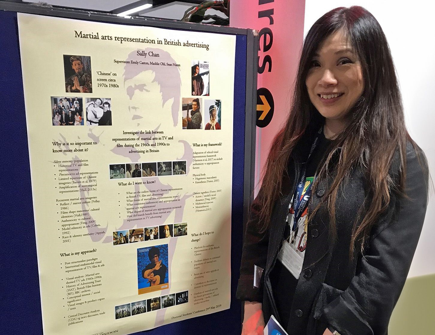 Sally stood next to her PhD poster display.