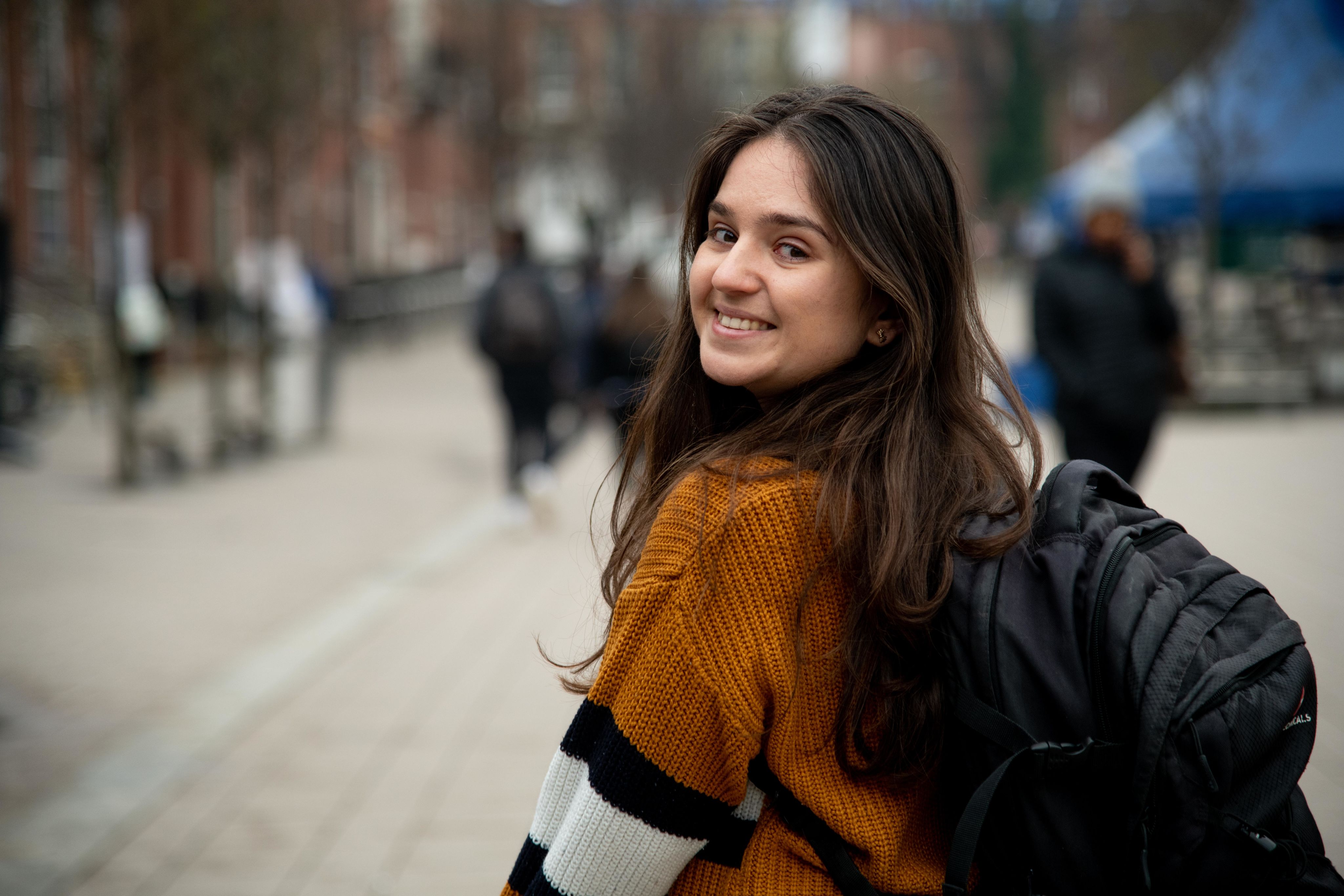 Meegan looking over her left shoulder outside Leeds University Union