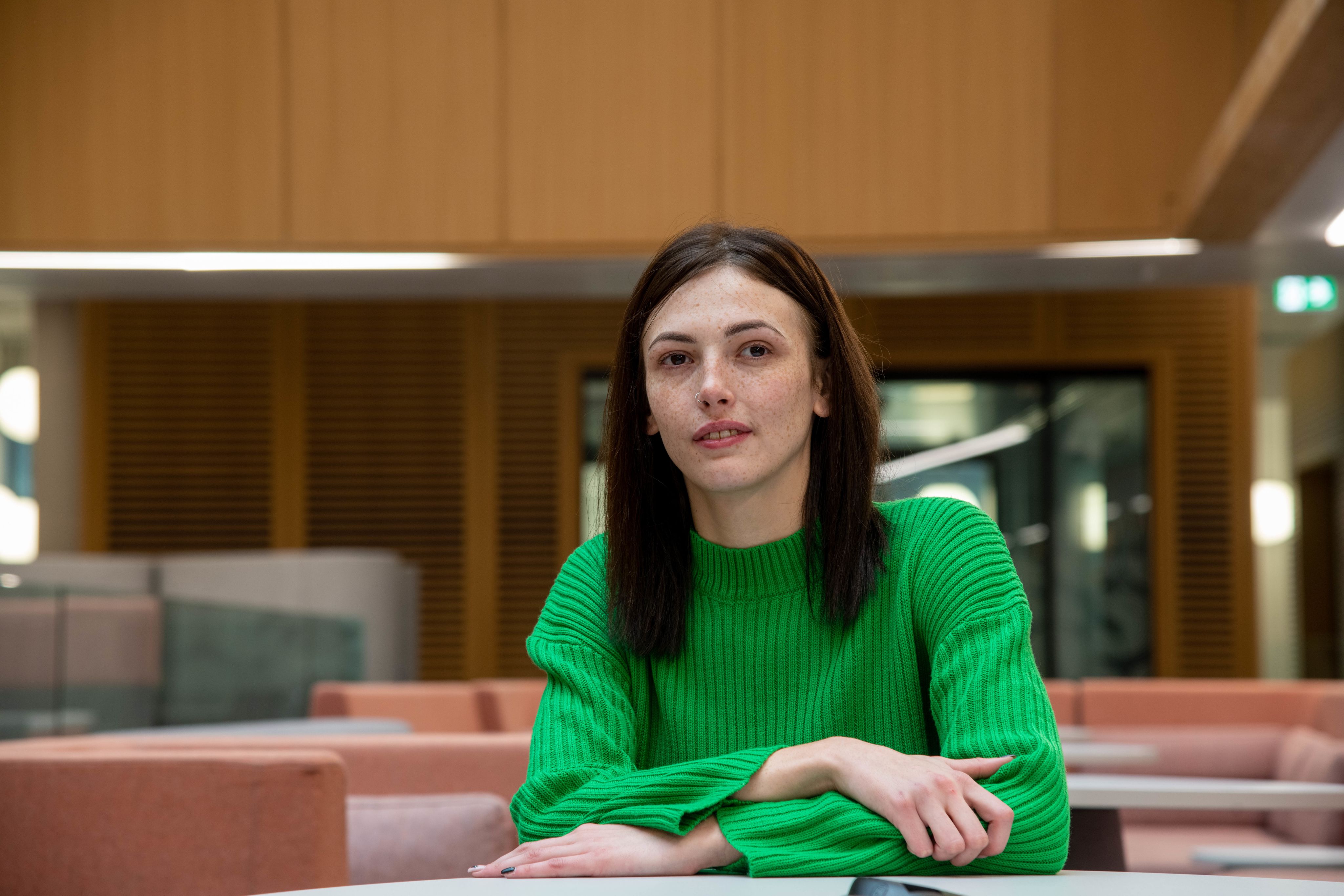 Emillie sat looking into distance