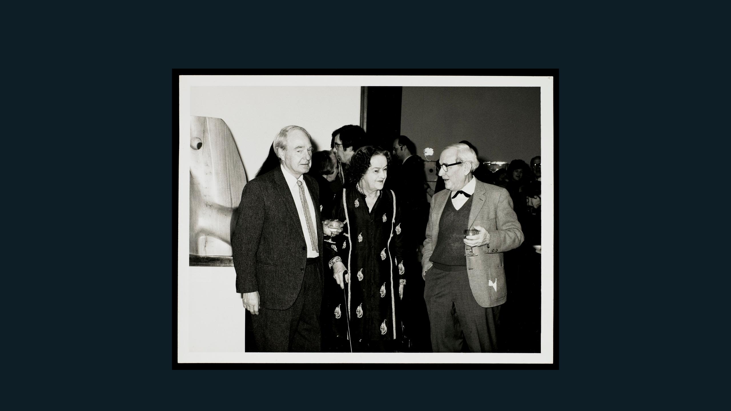 Event black and white photograph. Described under heading: Moore, Hepworth and Gabo with Figure (Nyanga)