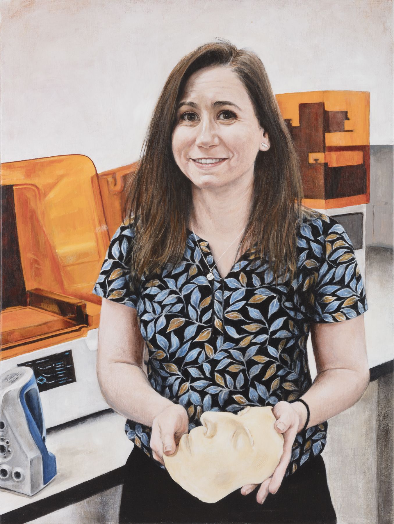 Portrait of Rachel Jablonski holiding a facial prosthesis