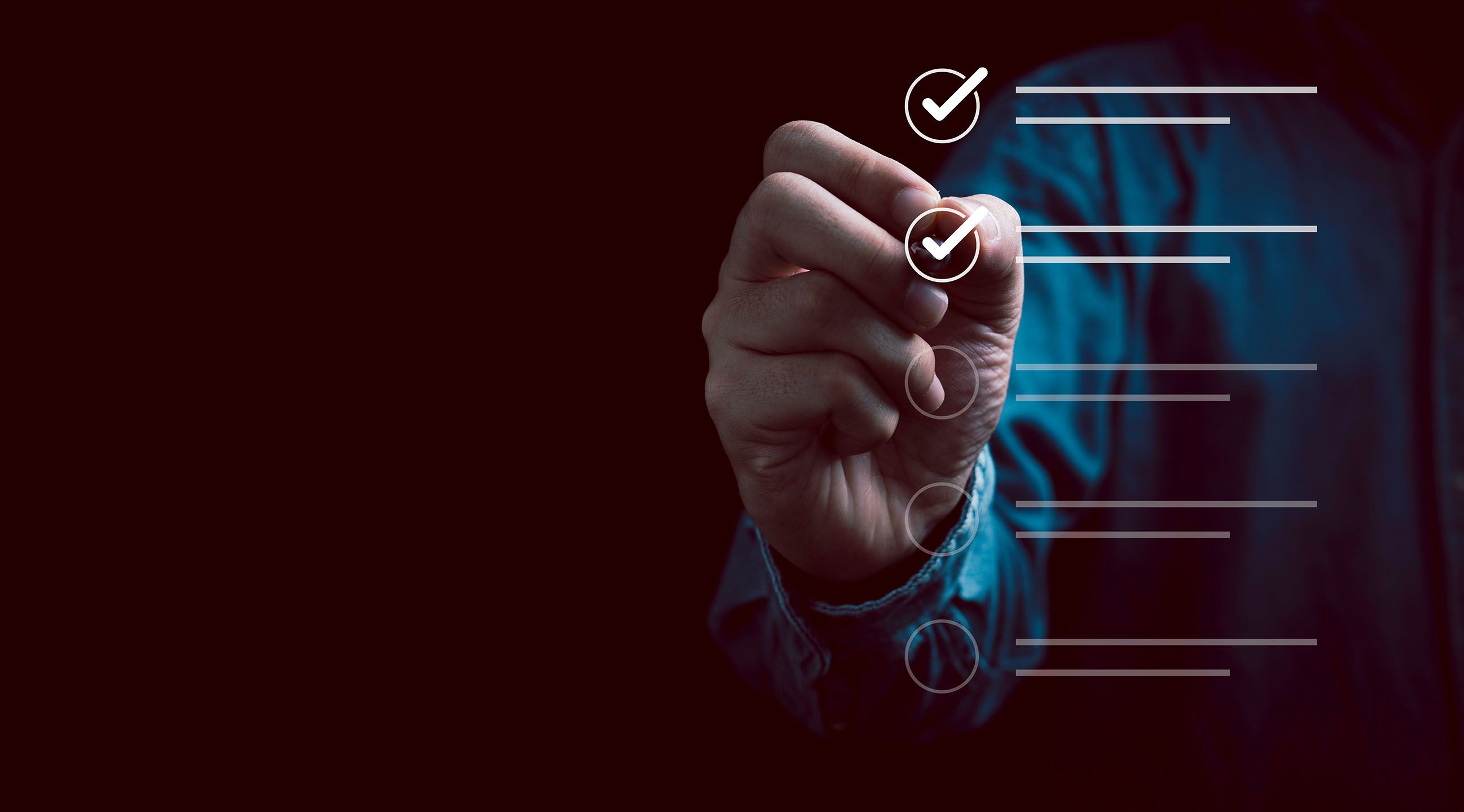 Hand with a pen ticking boxes on a graphic form