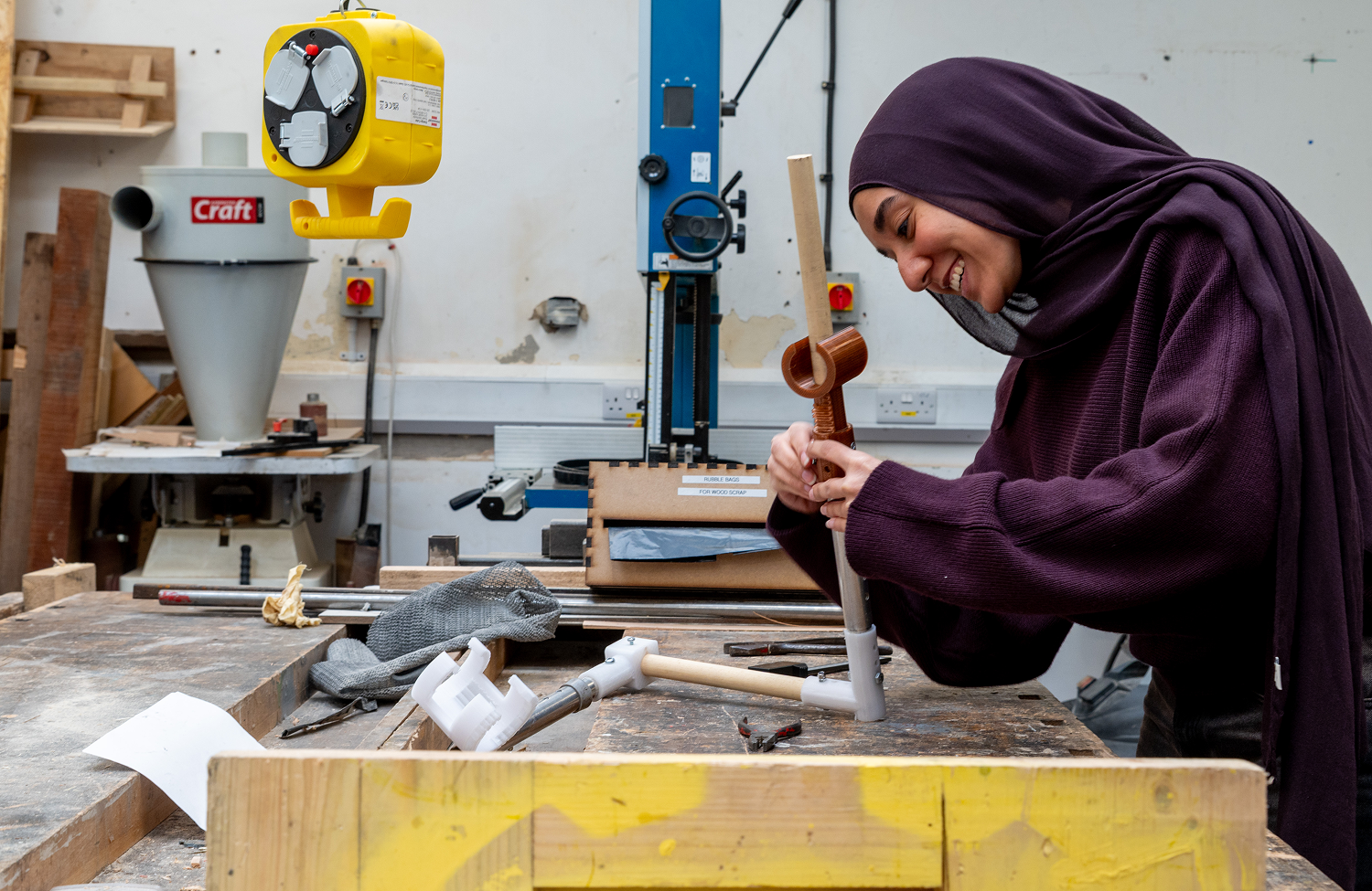 Fareda smiling in a workshop