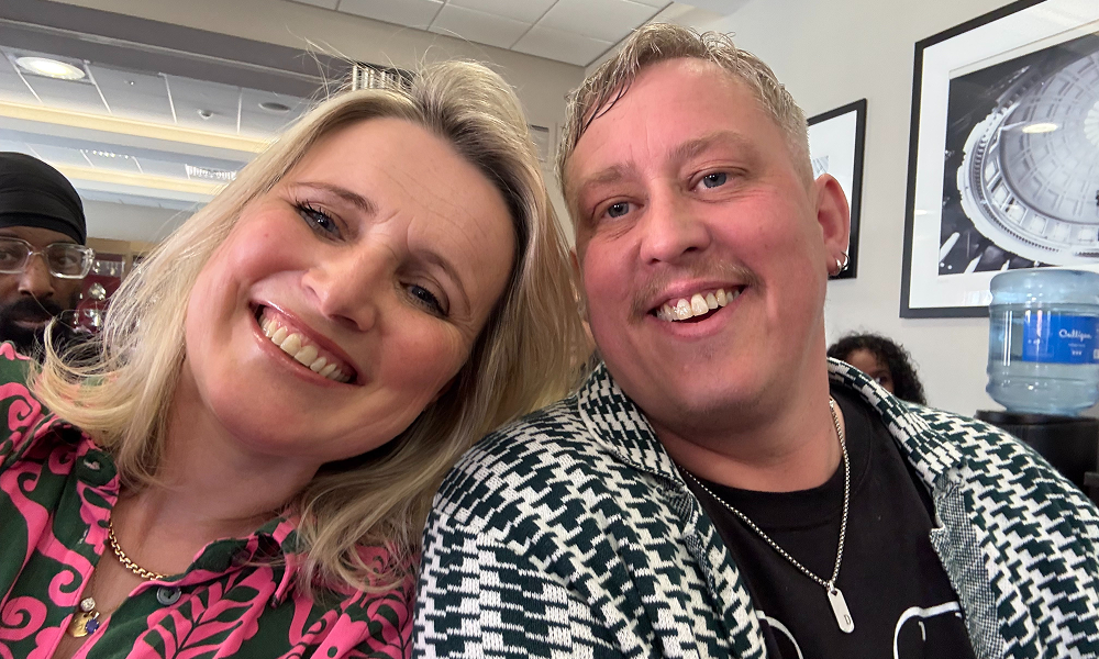 Two people smiling together for a picture