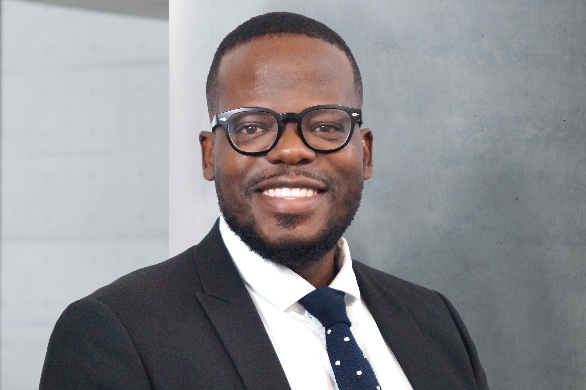 head and shoulders shot of man in glasses