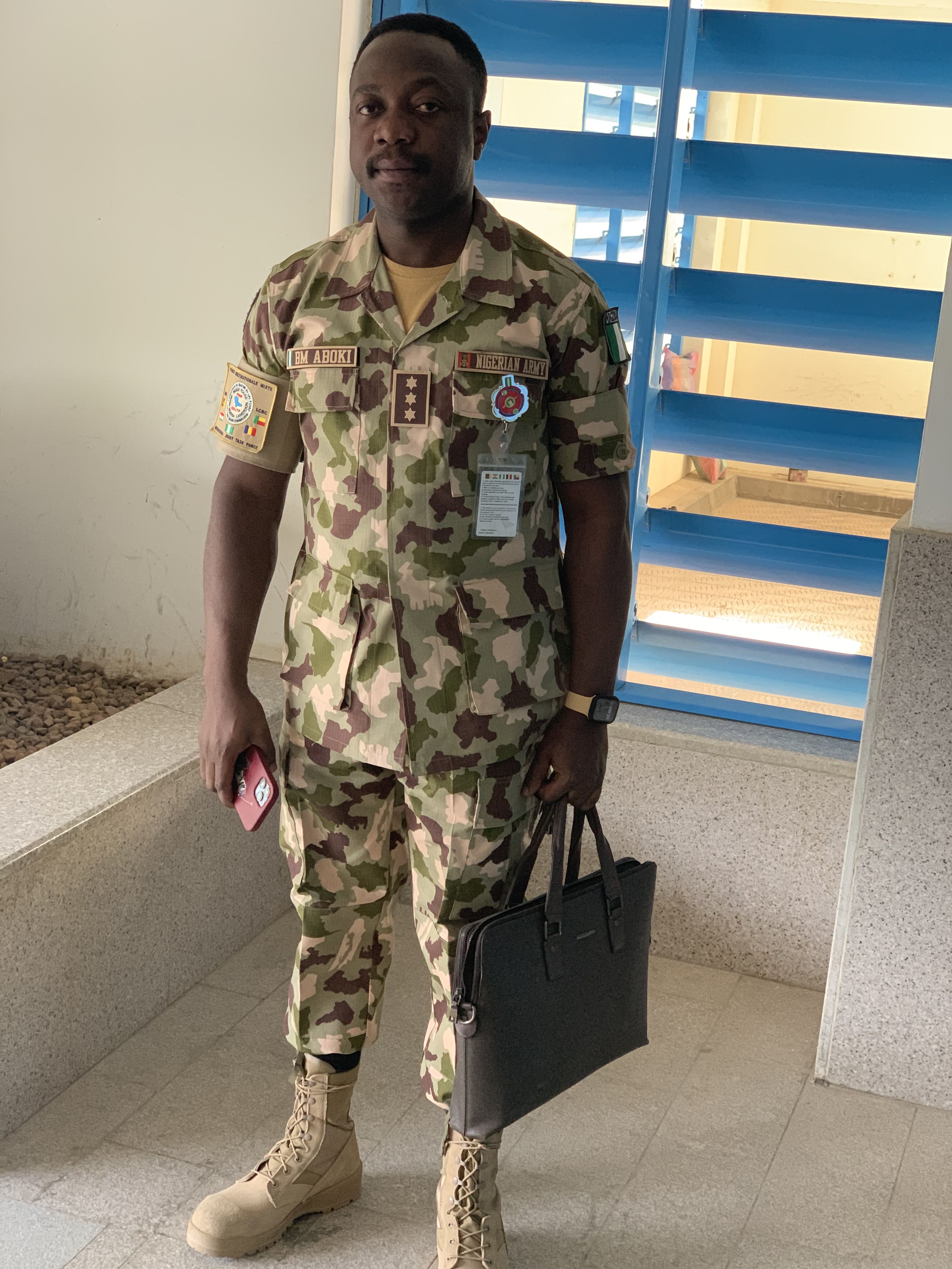 Man in army fatigues with attache case