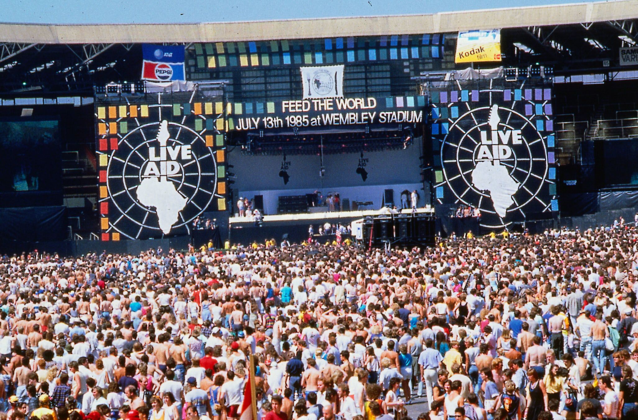 Crowd stand in front of the stage at Wembley for Live Aid 1985