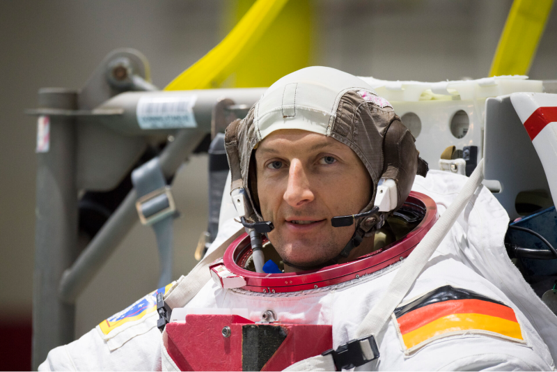 Matthias Maurer sits in spacesuit