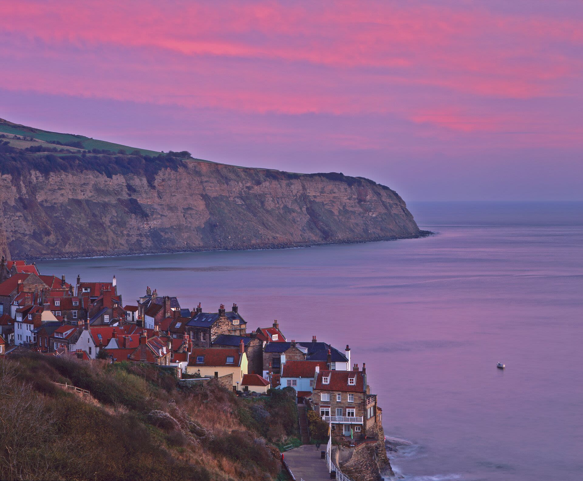 Cliff lit by a pink sunrise (or sunset)