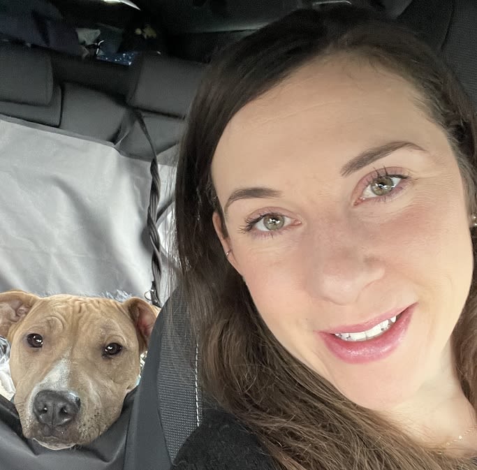Alicia Tomkinson poses for a selfie alongside her dog