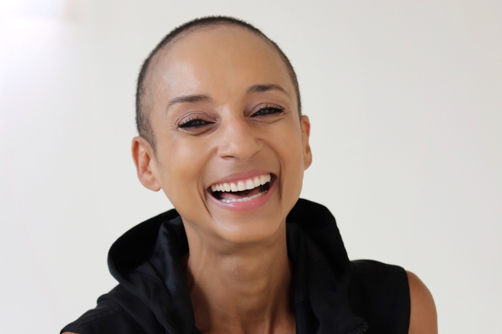 Adele Roberts laughs in profile image