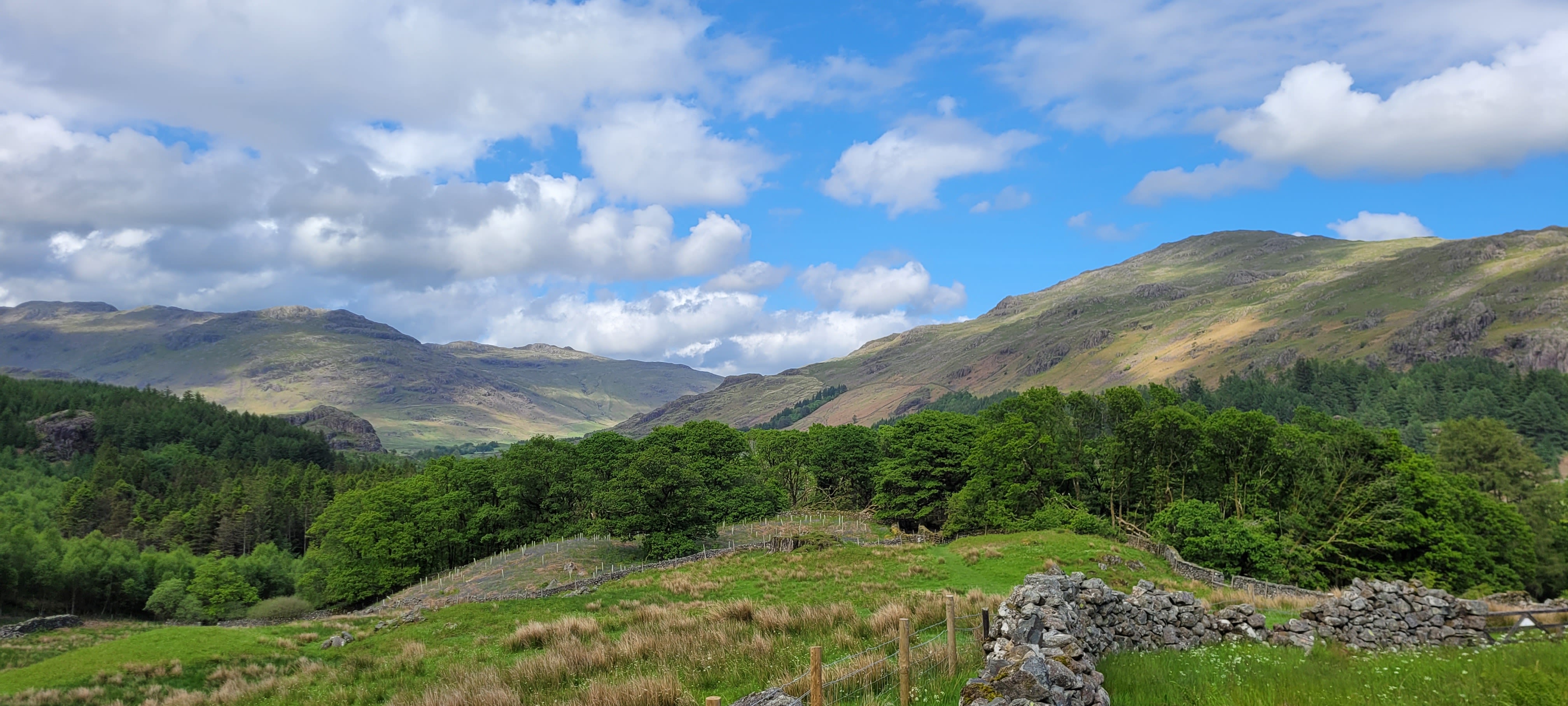 Green valley in the UK with hills in the distance