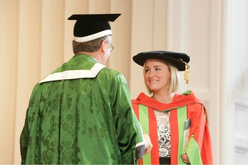 Student is awarded an honorary degree on stage