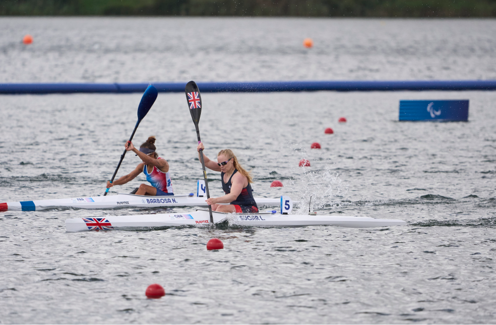 Two rowers race side by side
