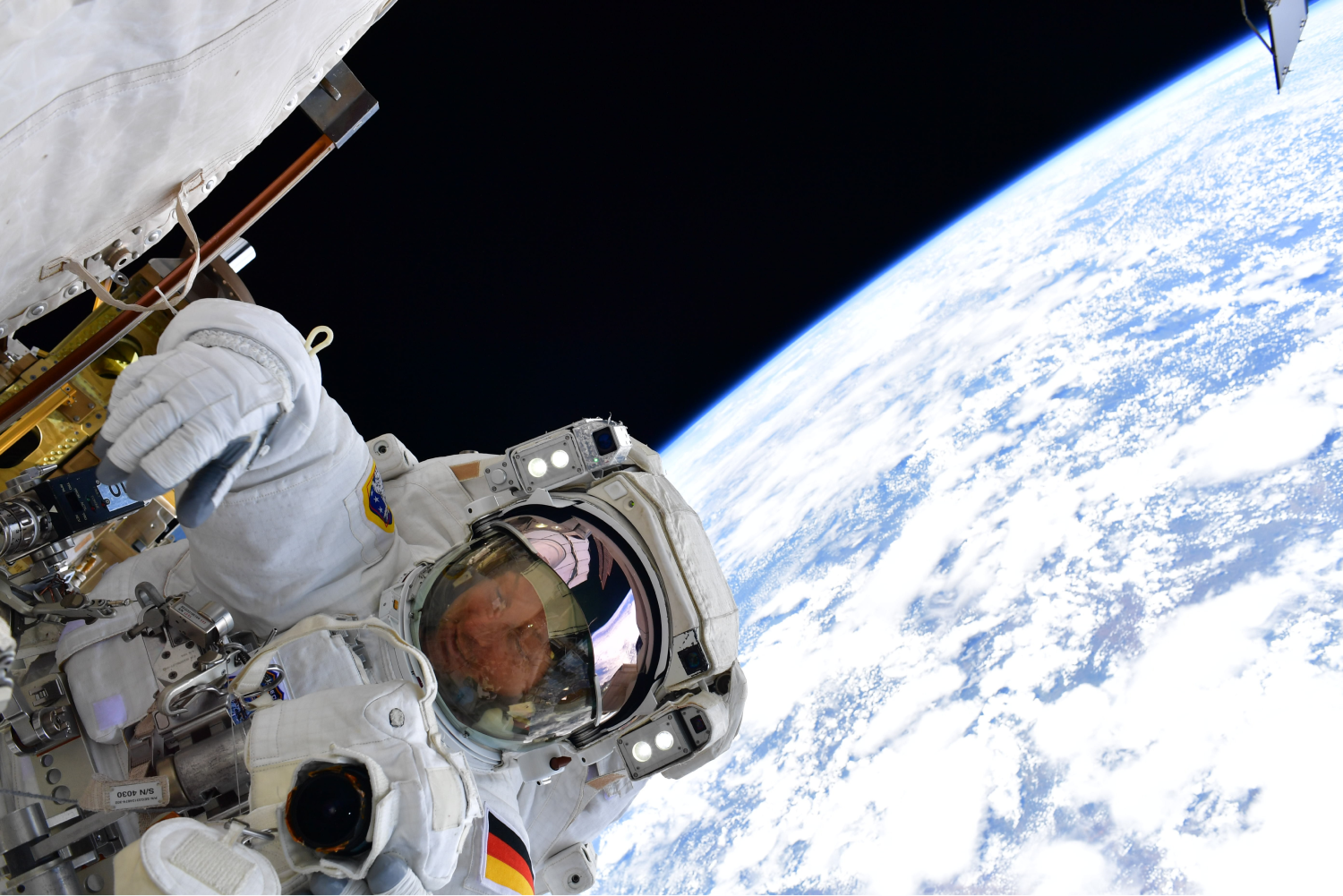 Astronaut performs a space walk in outer space