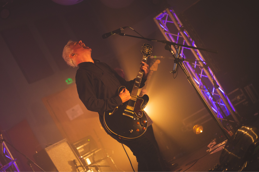 David Gedge performs on stage