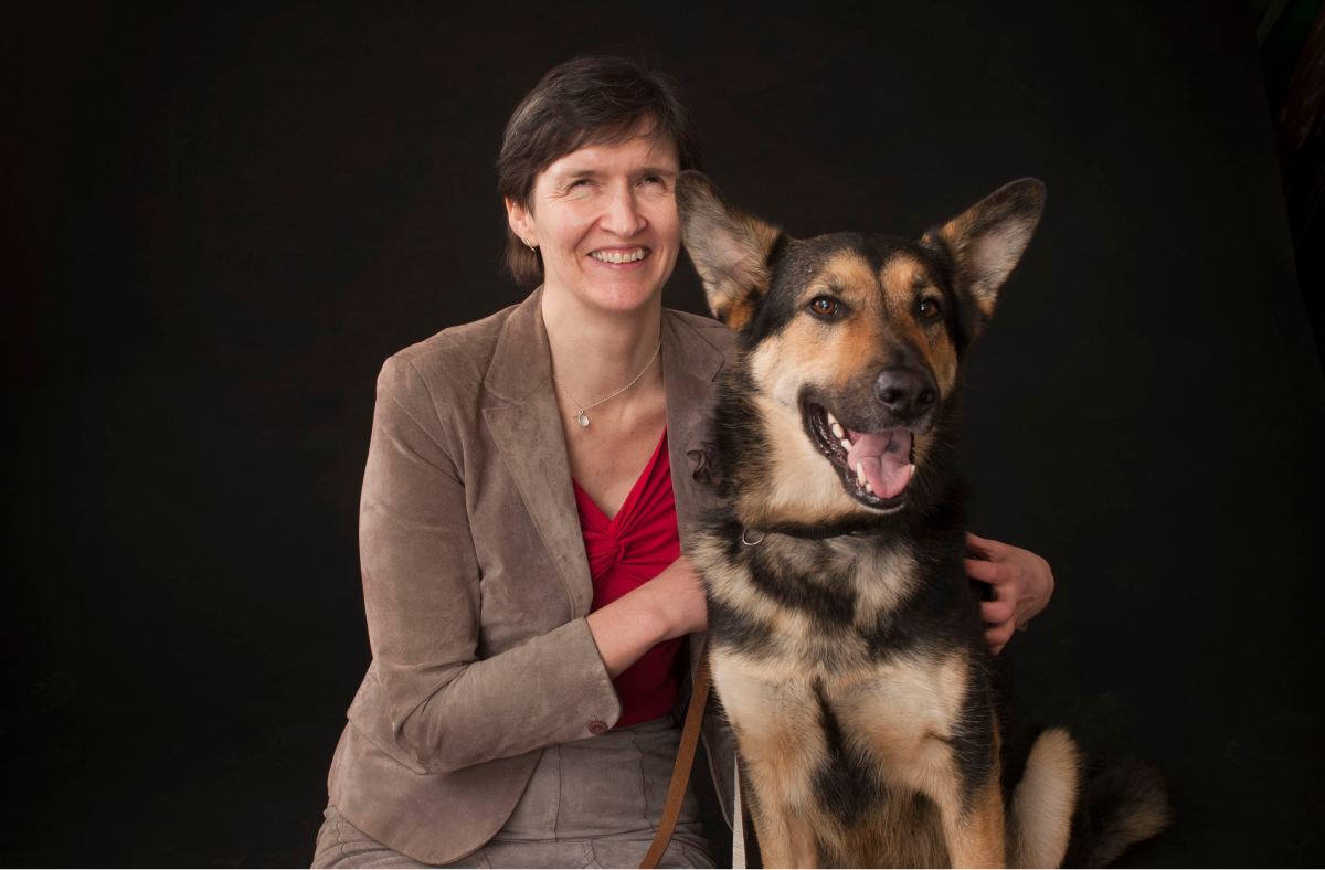 Anna Lawson sits with a dog