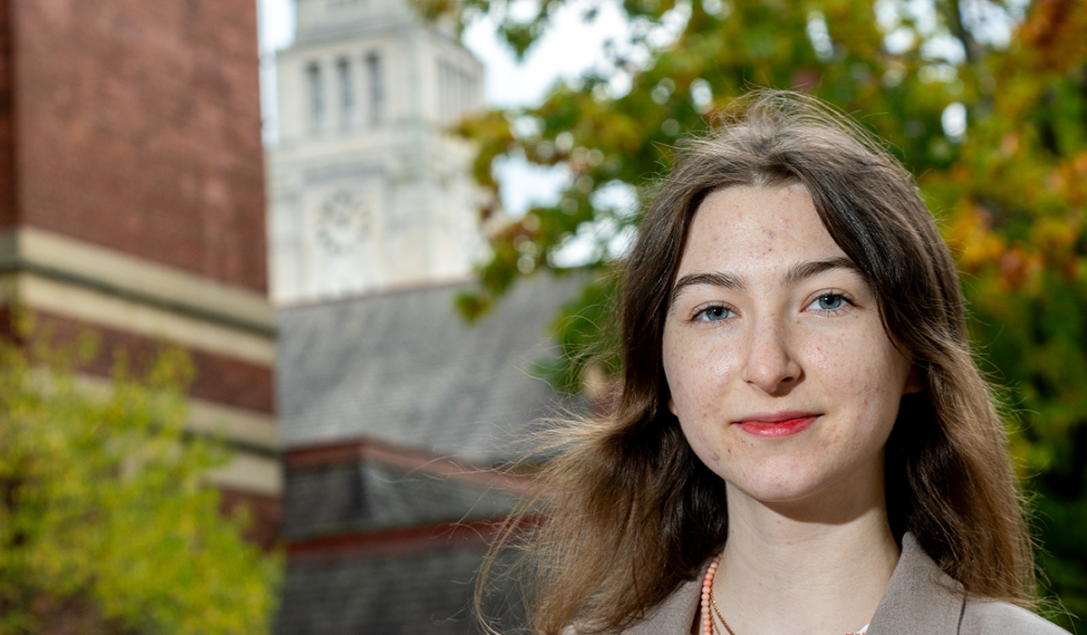 A student profile image with the Parkinson building visible in the background