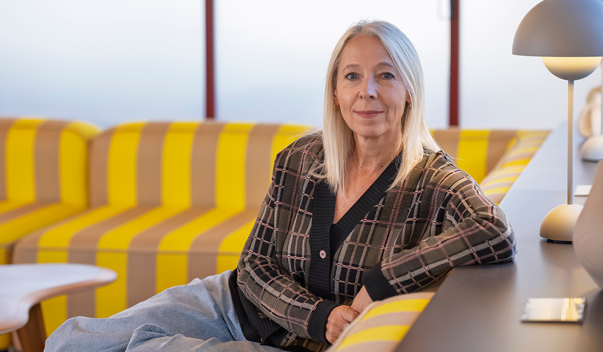 Jane Featherstone sat on a sofa