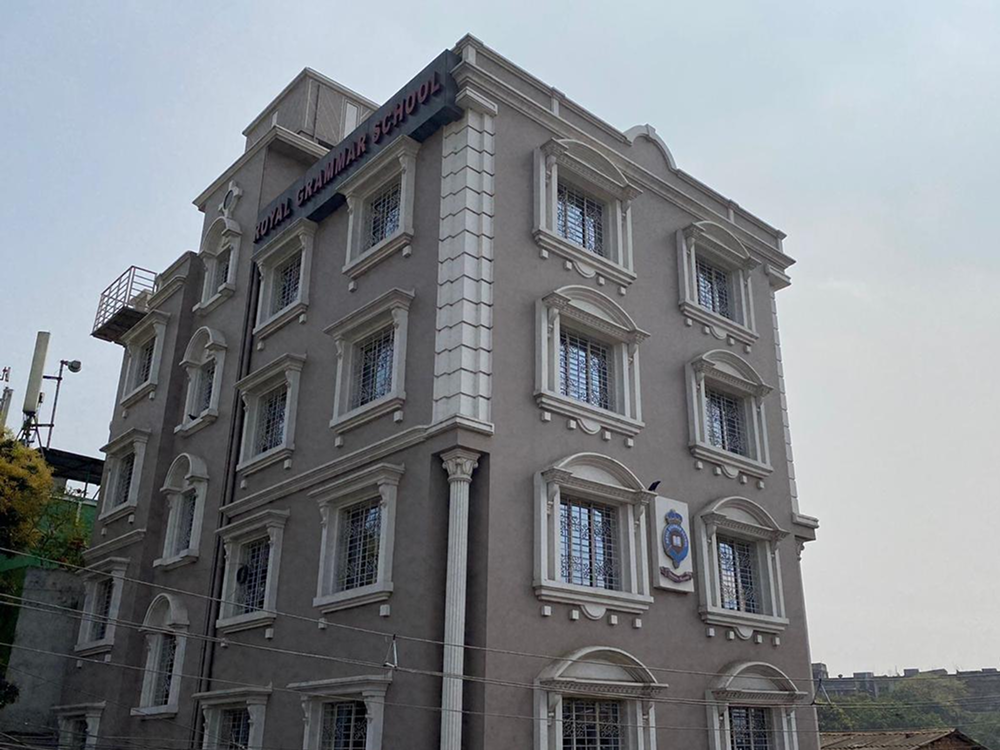 A grey four-storey school building