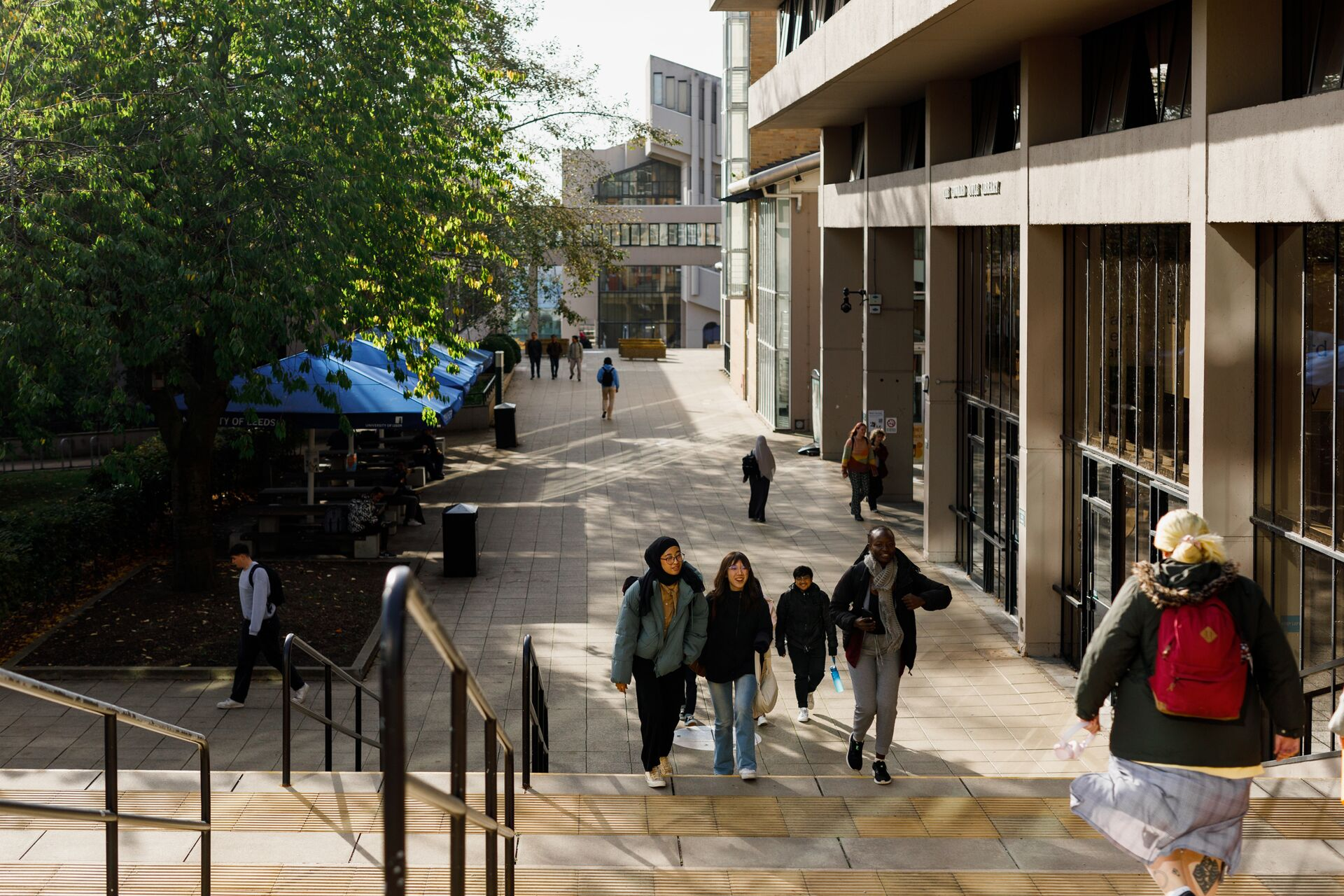 Students walk by outside the Edward Boyle Library at the University of Leeds