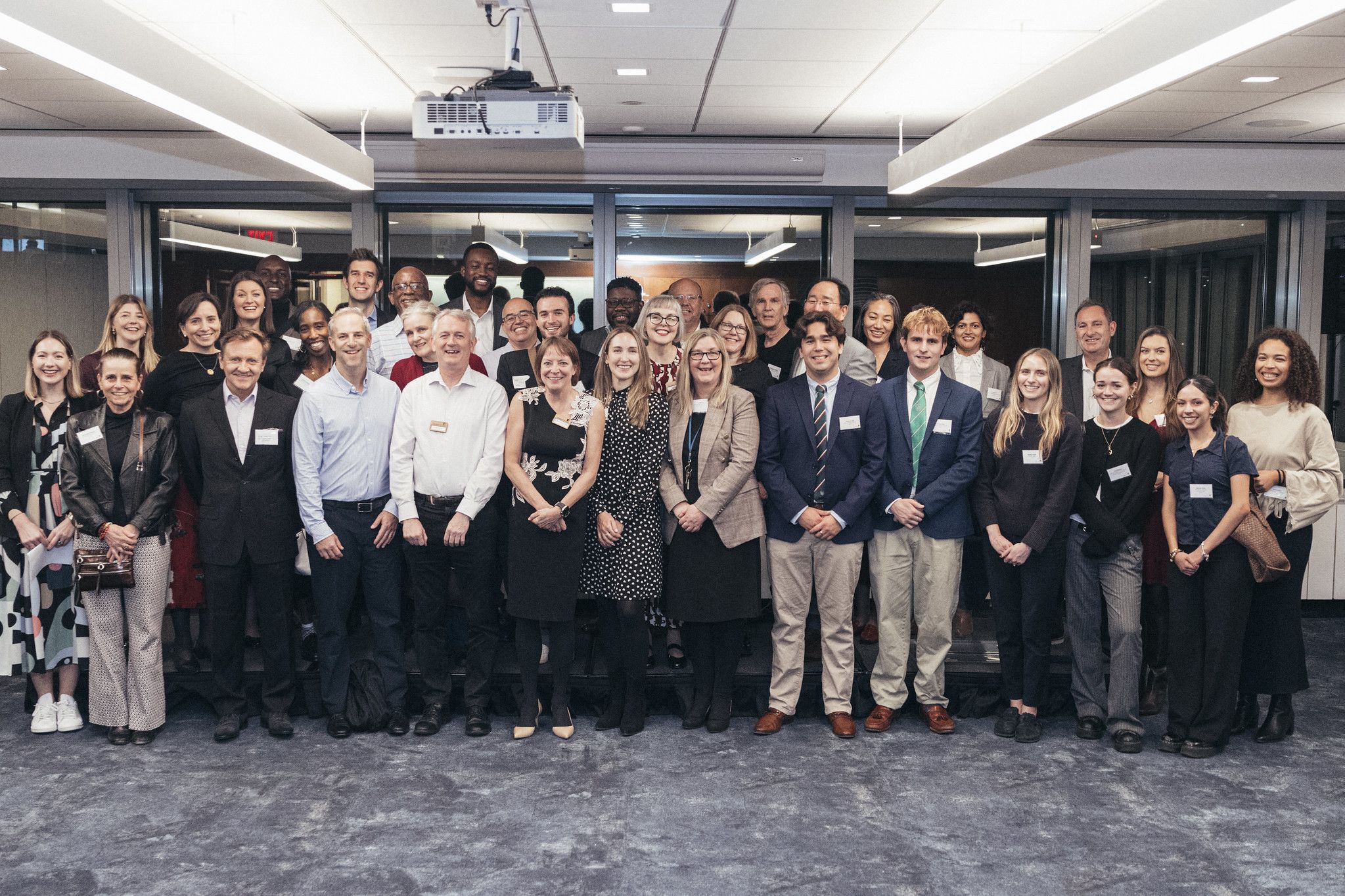A group of individuals pose for a photo at an event