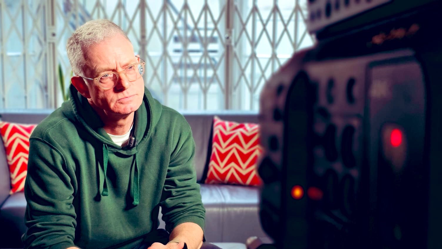 Andrew Hartle sits facing a camera during an interview