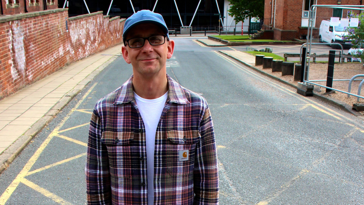 Paul Johnson profile image. Paul is wearing a cap and a check shirt.