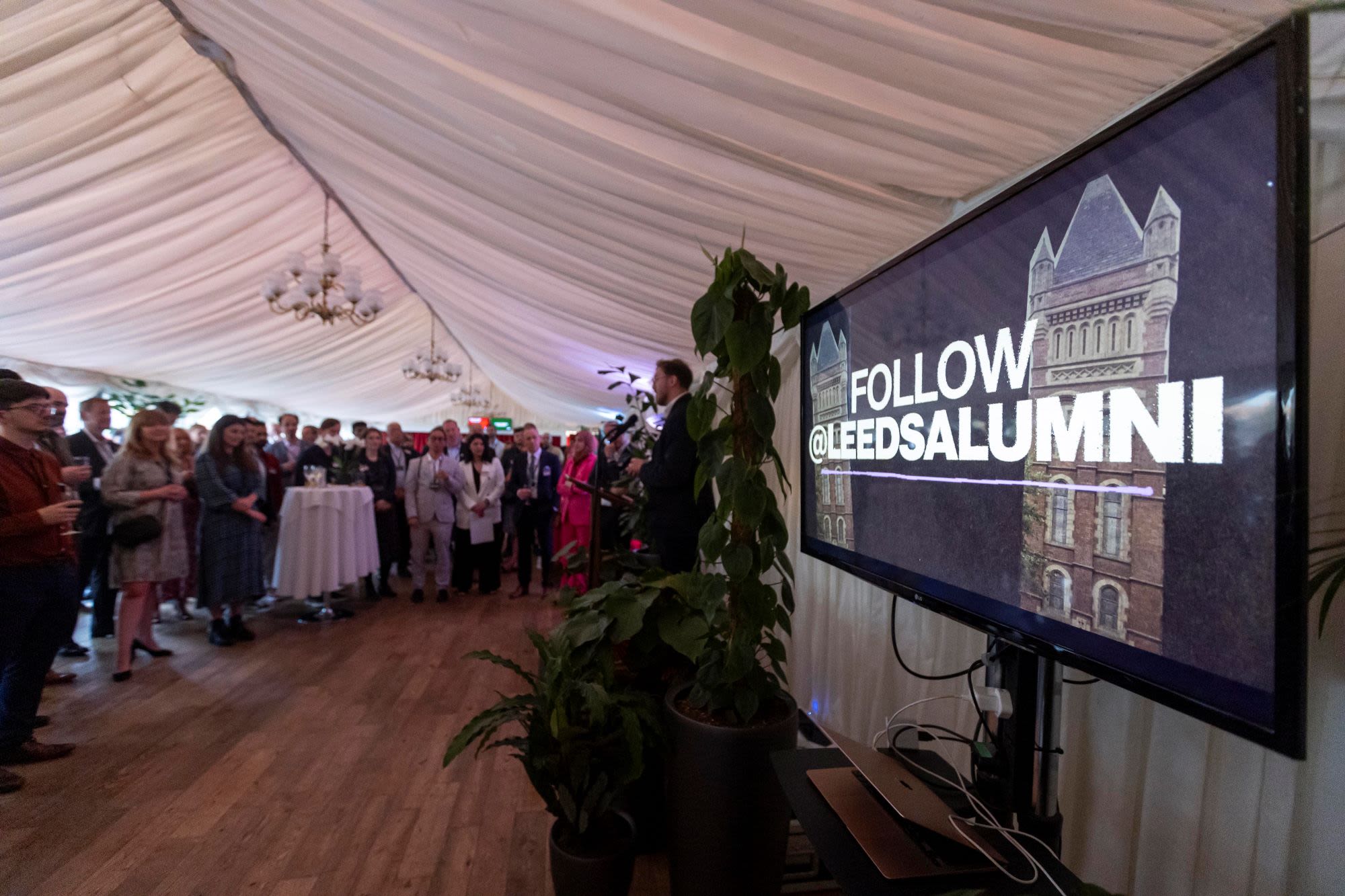 television screen saying @Leedsalumni