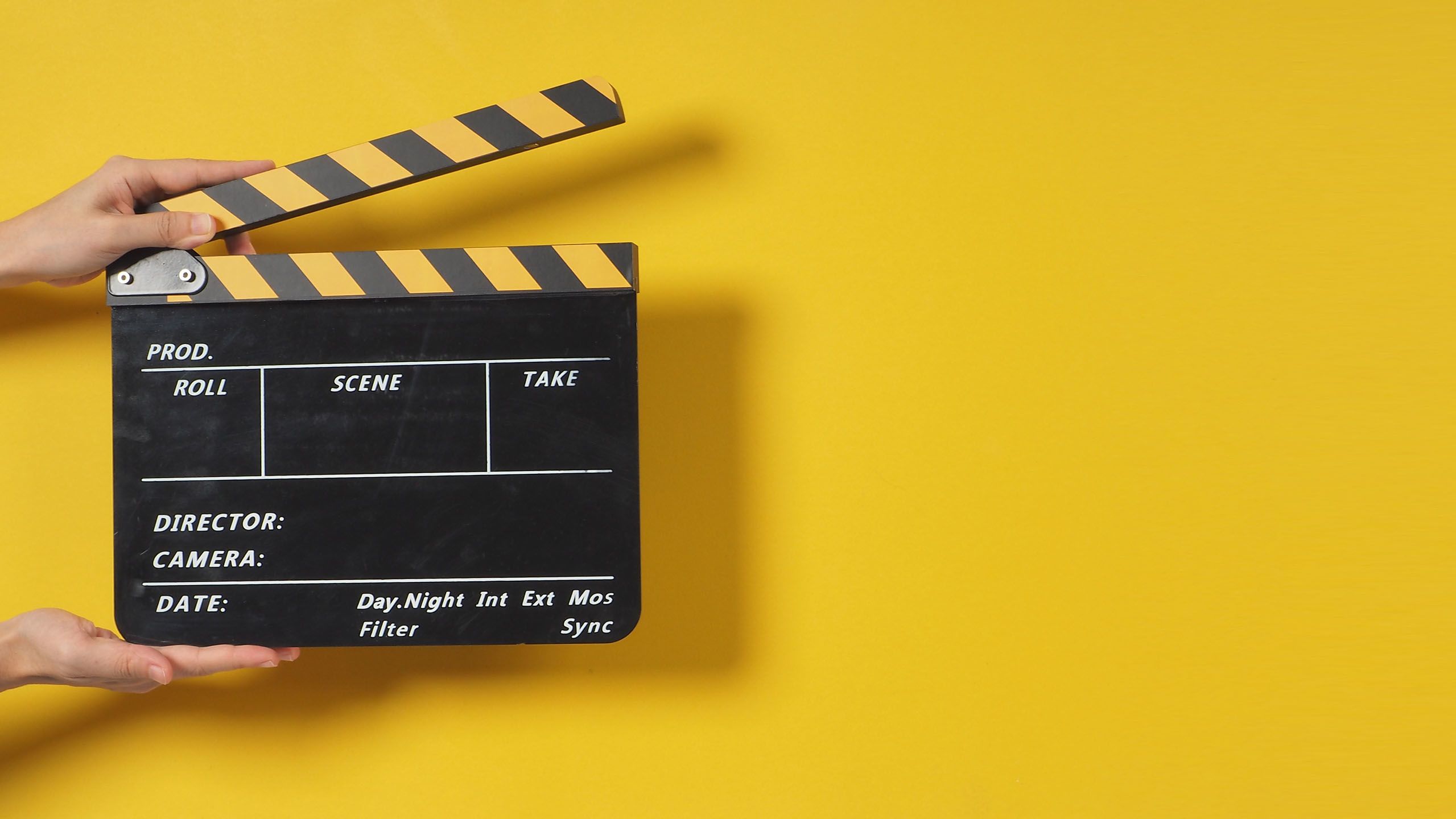 A black and yellow clapperboard