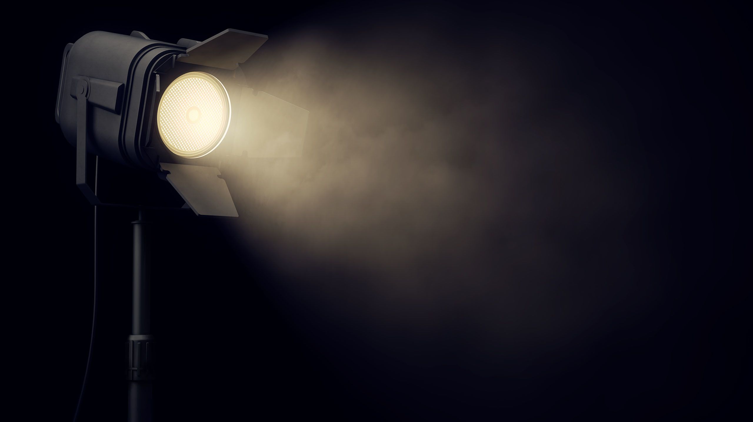 A spotlight shining in a dark room