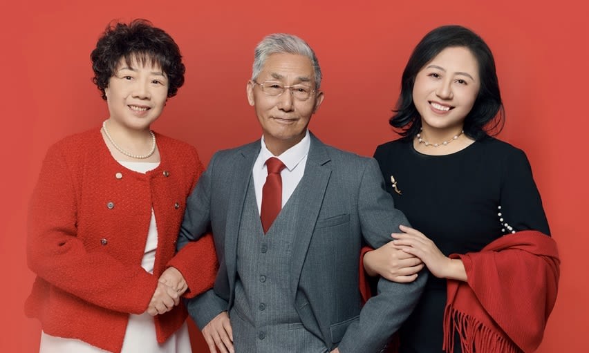 Professor Lynda Jiwen Song (right) with parents