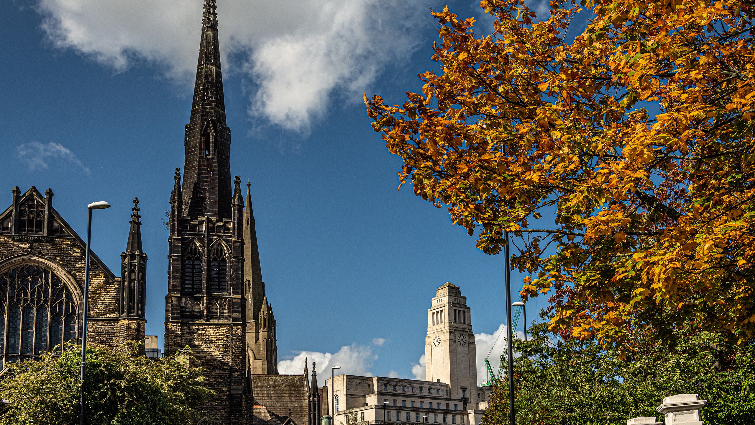 The Parkinson Building, a former church and a tree with orange leaves