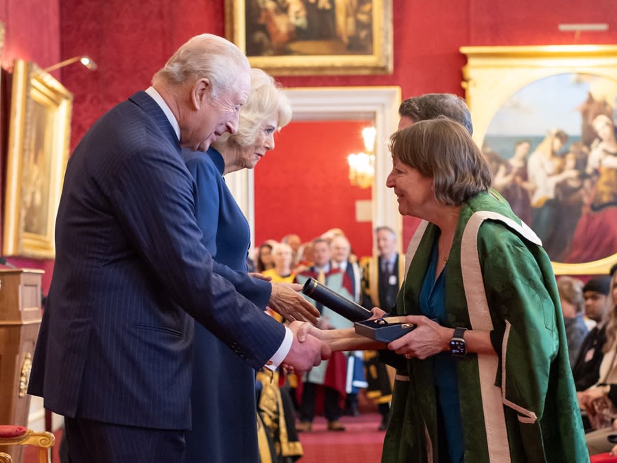 King Charles III and Queen Camilla present Professor Shearer West, Vice-Chancellor and President of the University of Leeds and Professor Stephen Russell, Director of Leeds Institute of Textiles and Colour with the Queen Elizabeth Prize for Education