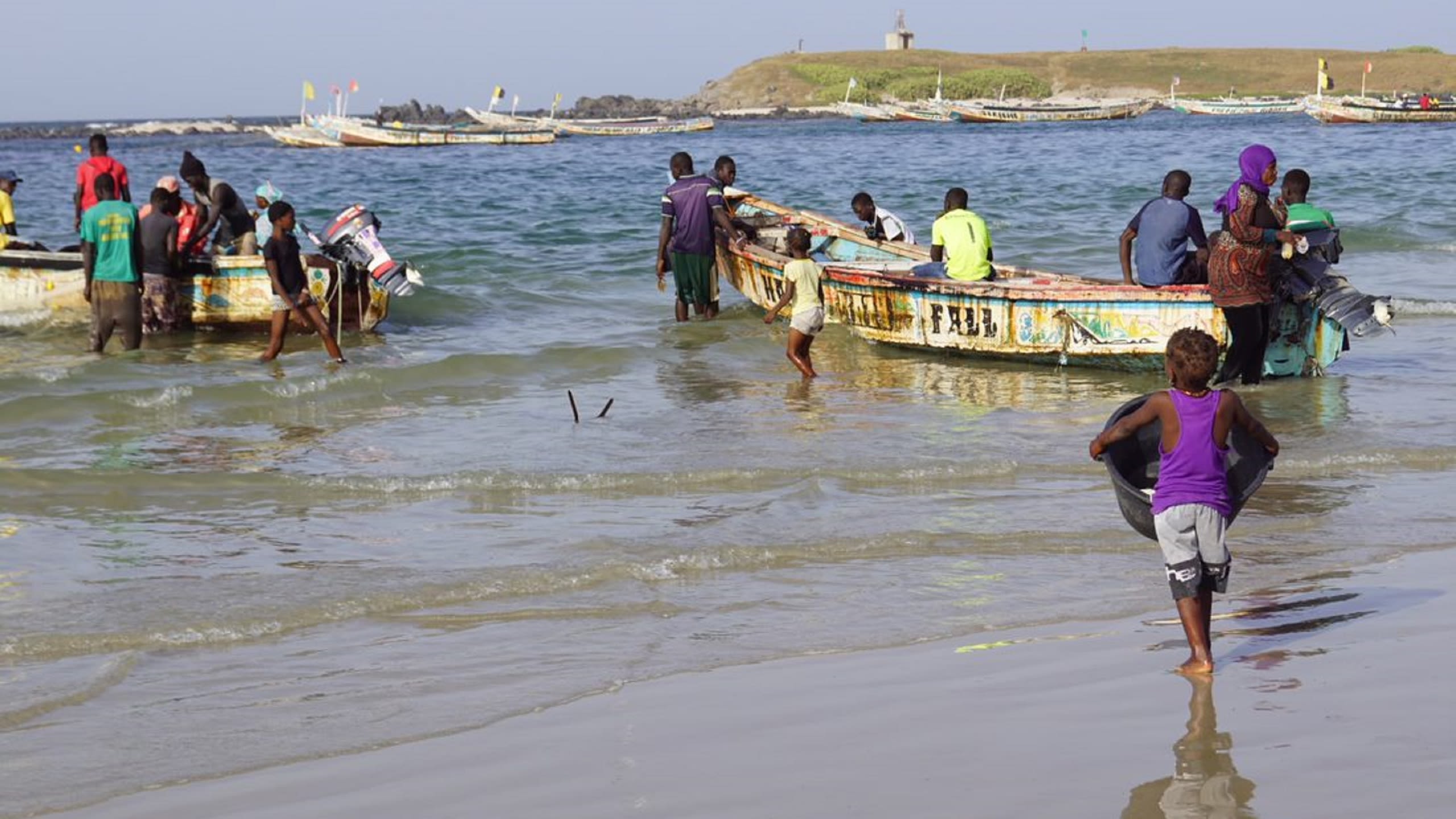 Fishing people about to set sail
