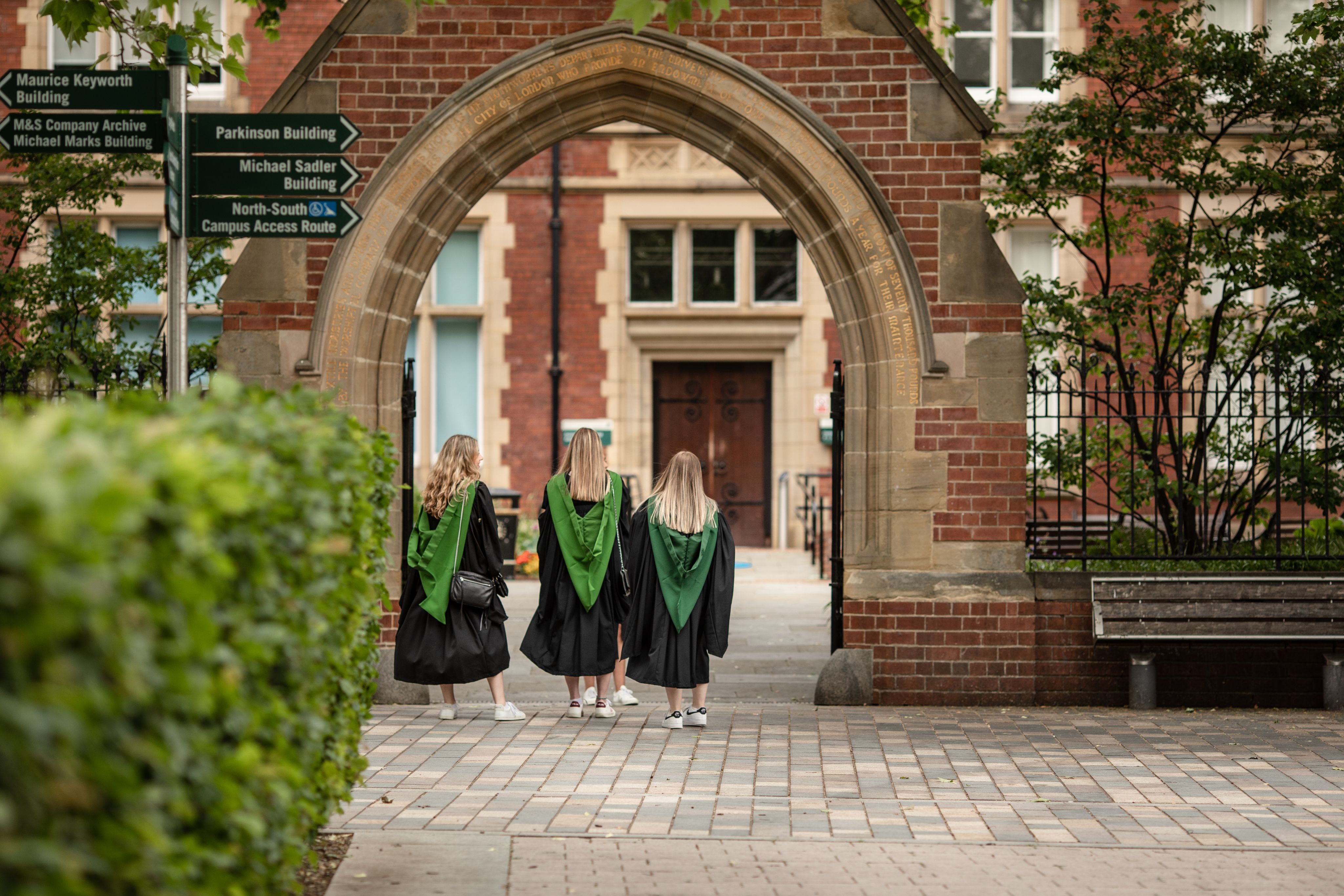 three graduands on graduation day