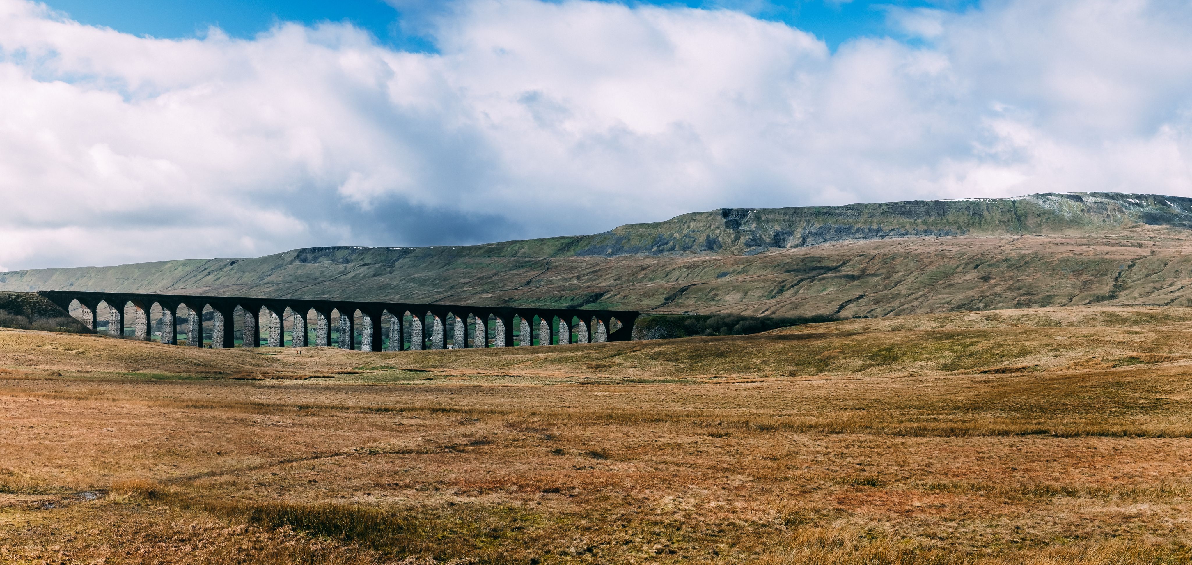 Ribblehead Viaduct with Whernside mountain behind.