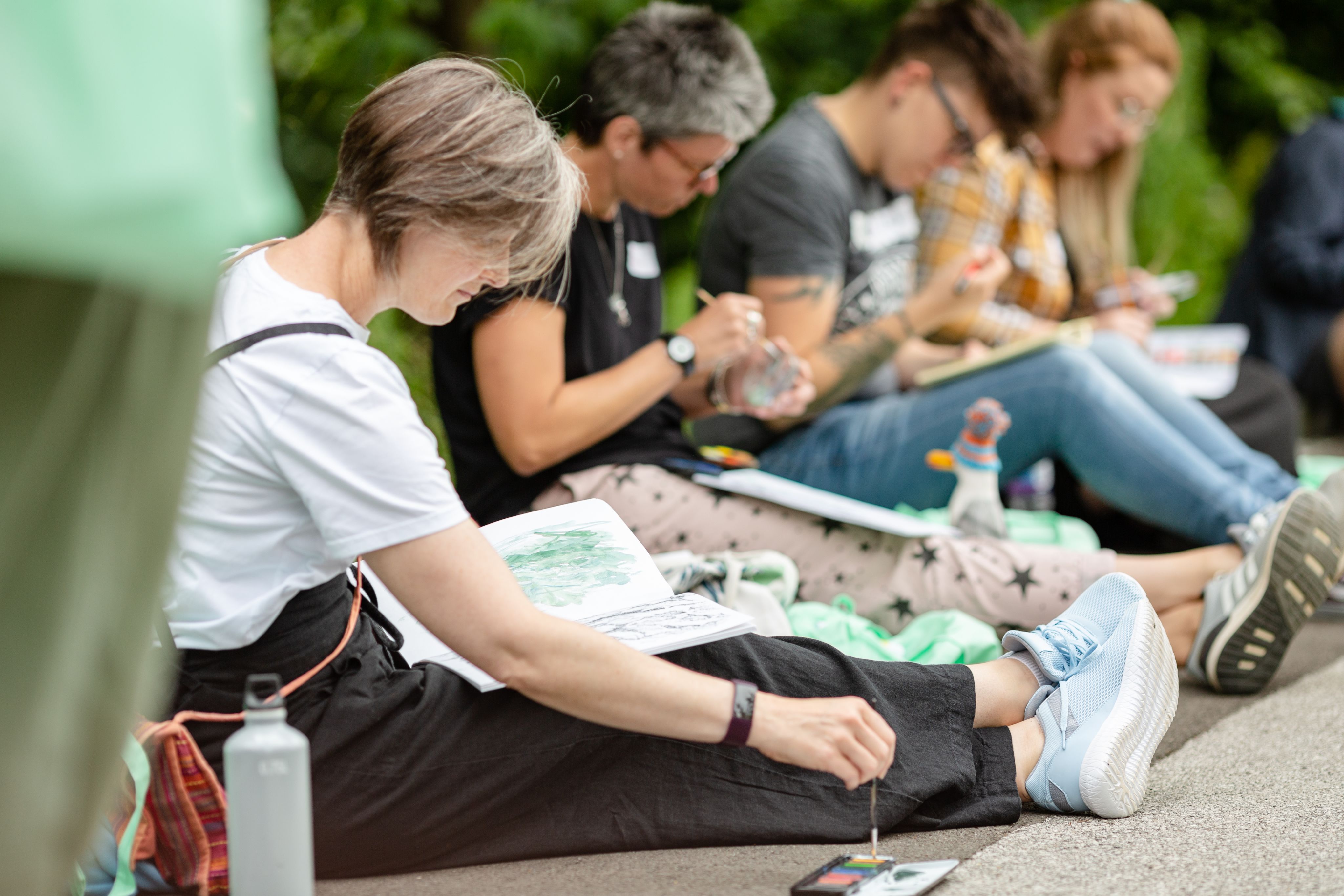 Image of school teachers painting together on campus