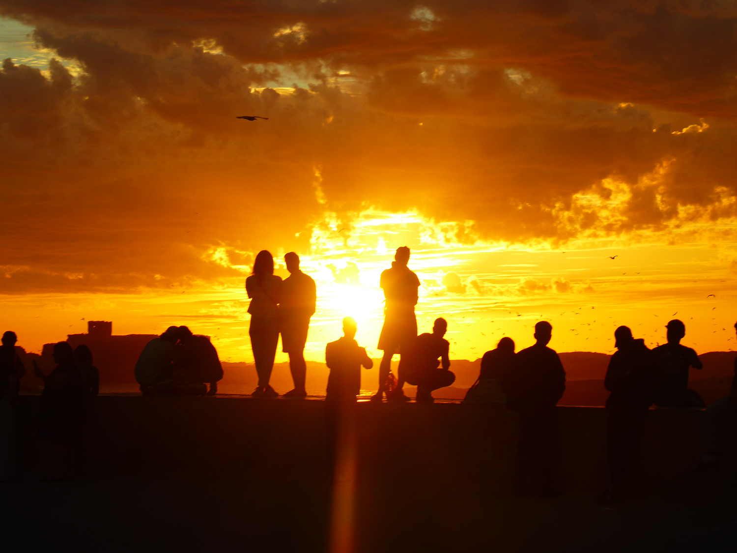 A group gather at sunset