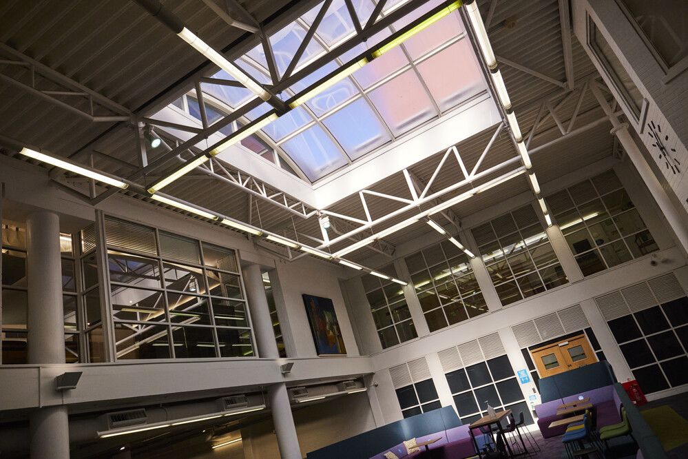 The inside of a large atrium looking up at the rooflight.