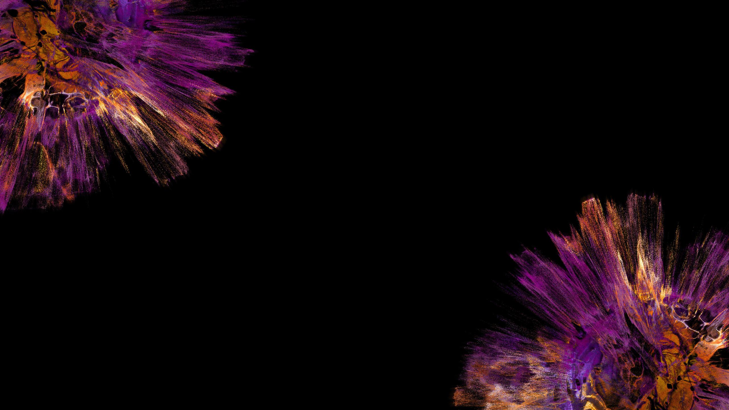 Orange and purple splashes on a black backdrop