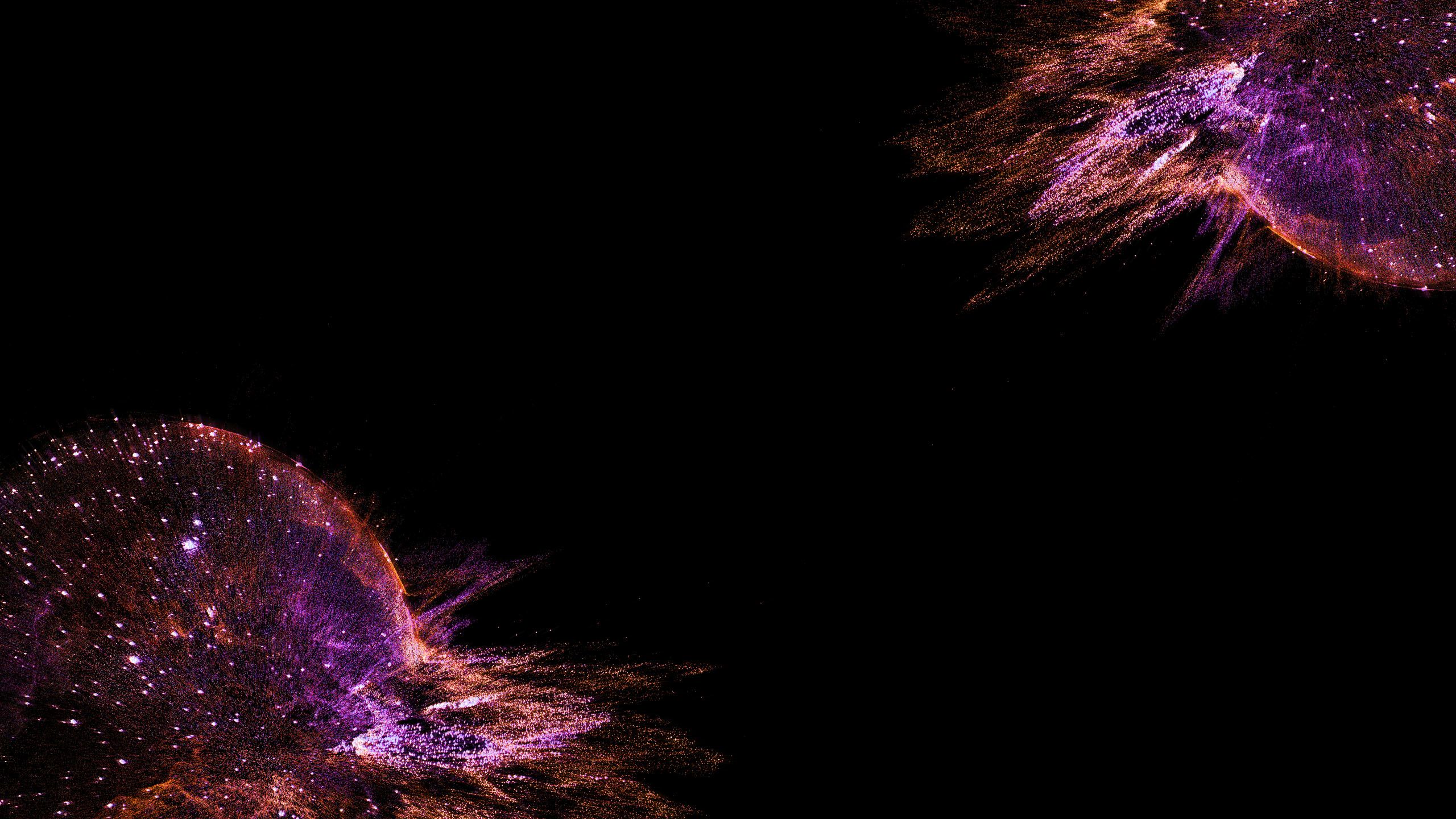 Orange and purple splashes on a black backdrop