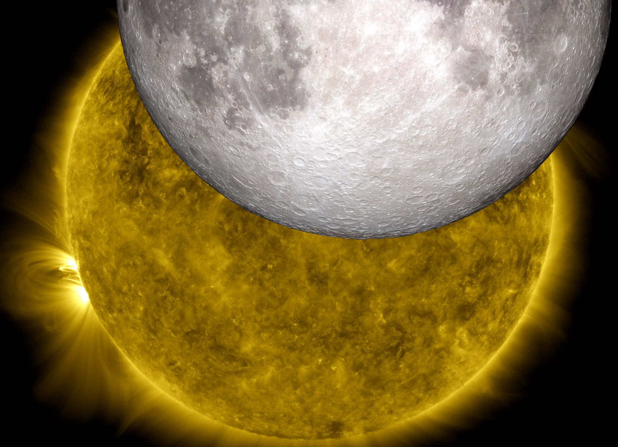 Close shot of two NASA images: An image rendered from a model of the moon from the Lunar Reconnaissance Orbiter overlaid onto an image of the sun from the Solar Dynamics Observatory, during a lunar transit.